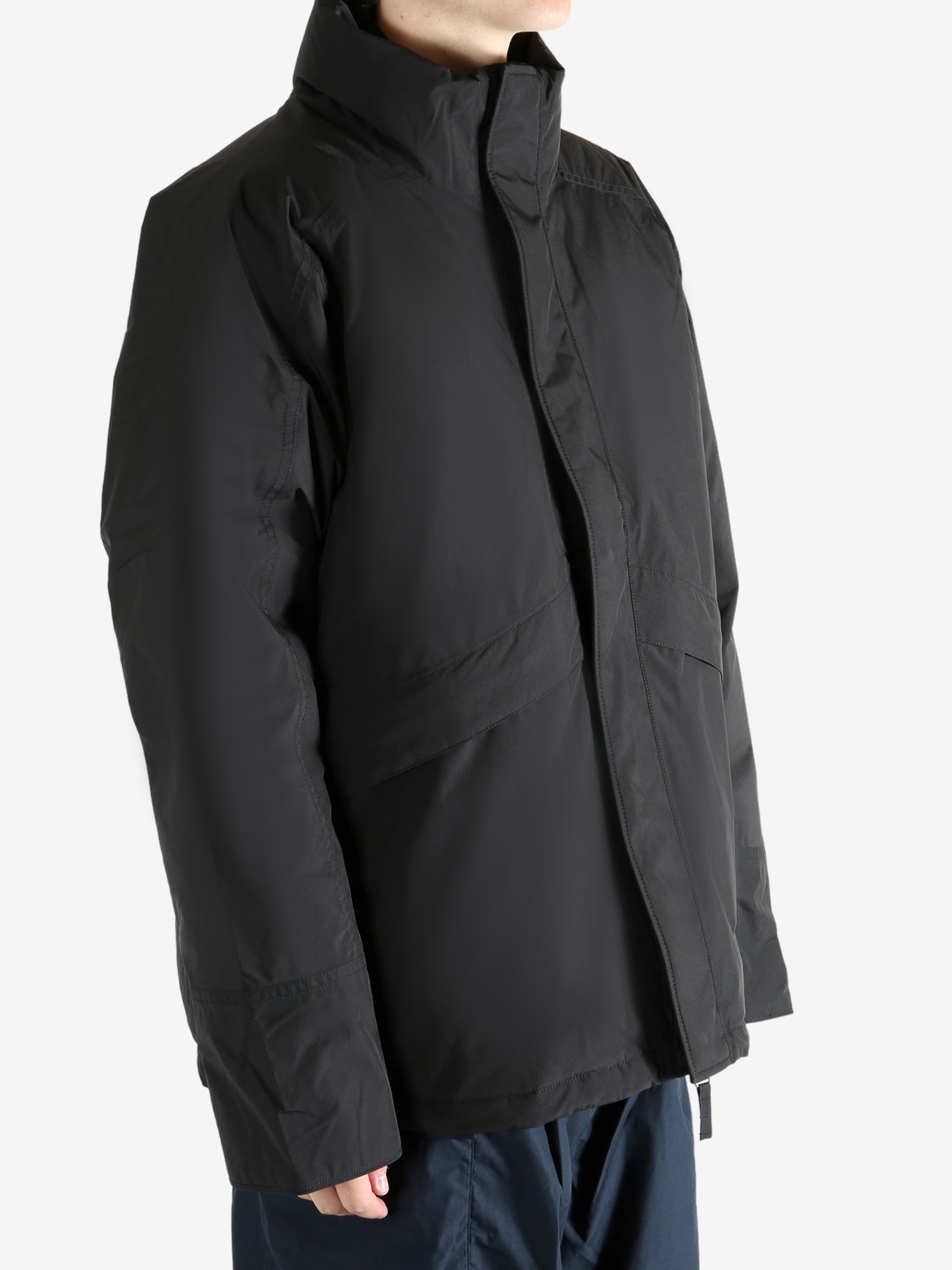 Black jacket worn by a person, showing the jacket's fit