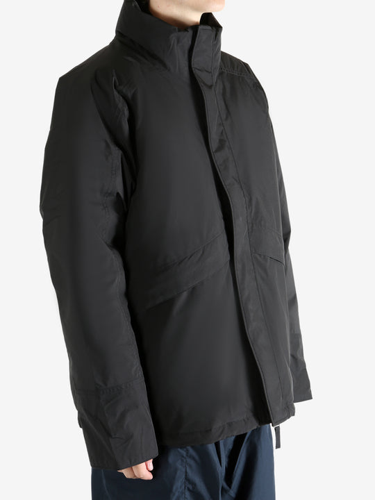 Black jacket worn by a person, showing the jacket's fit