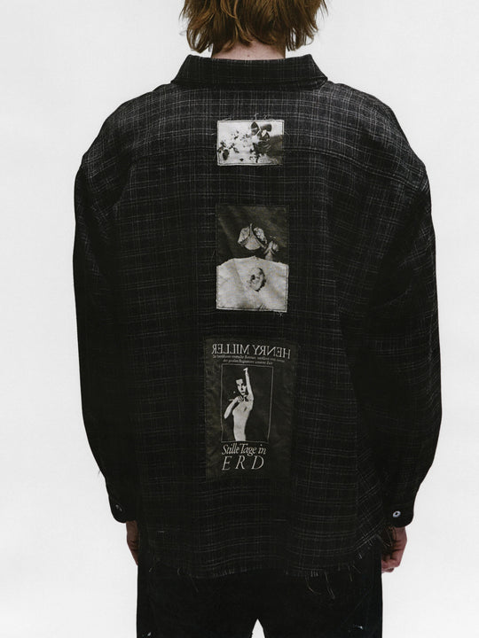 Black shirts worn by a person, showing the shirts fit