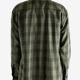 Black shirt worn by a person, showing the shirt's fit