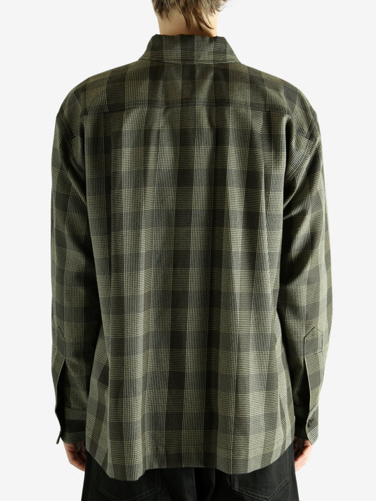 Black shirt worn by a person, showing the shirt's fit