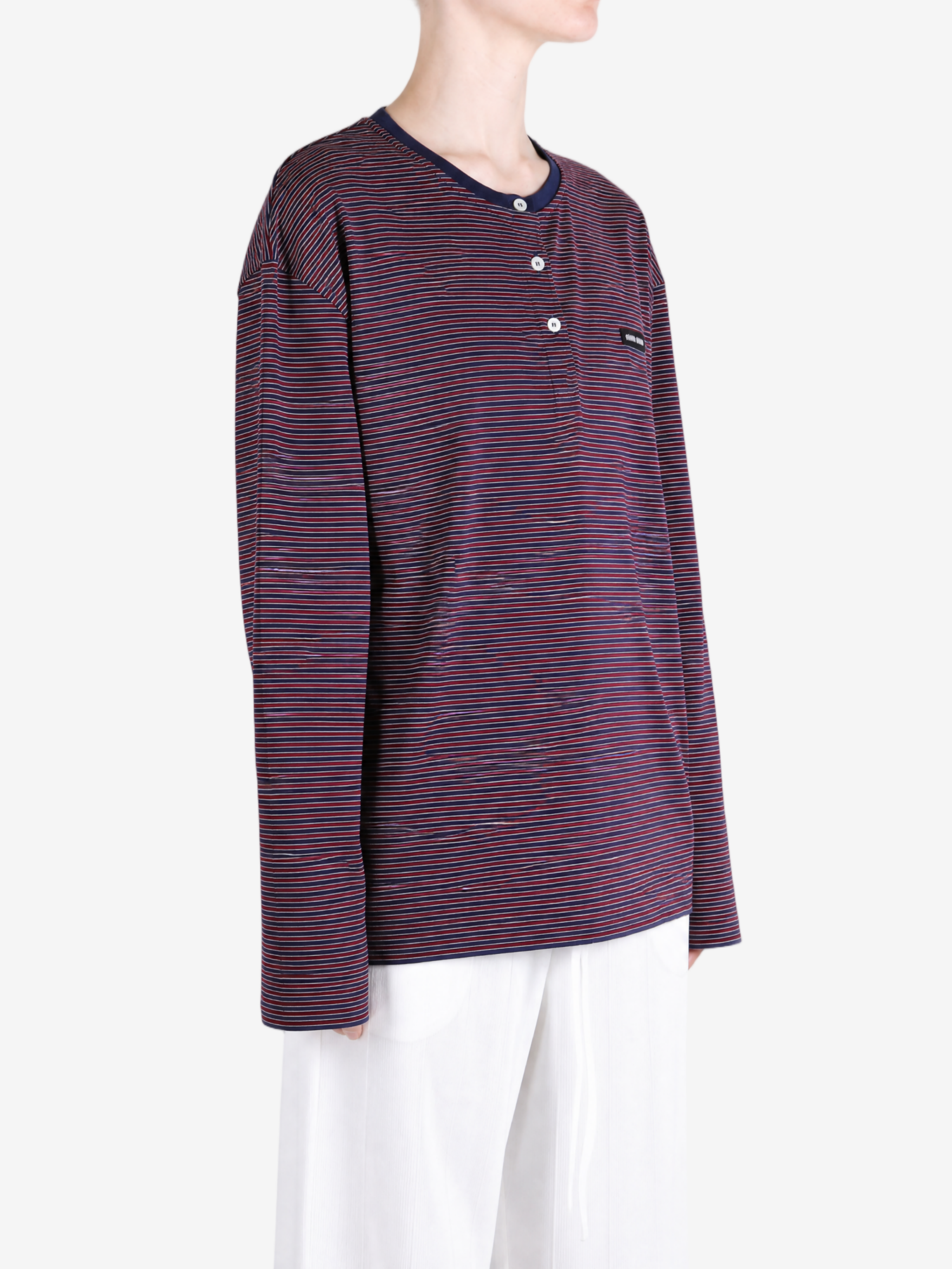 Navy top worn by a person, showing the top fit