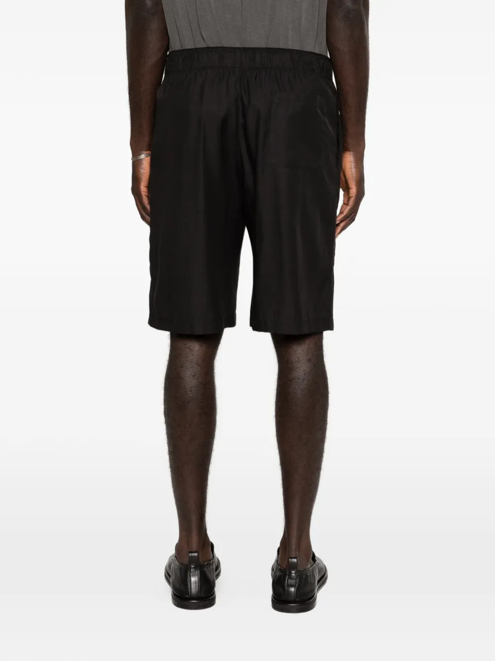 Black shorts worn by a person, showing the shorts fit