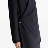 Close up of black coats , showing texture of the blended fabric