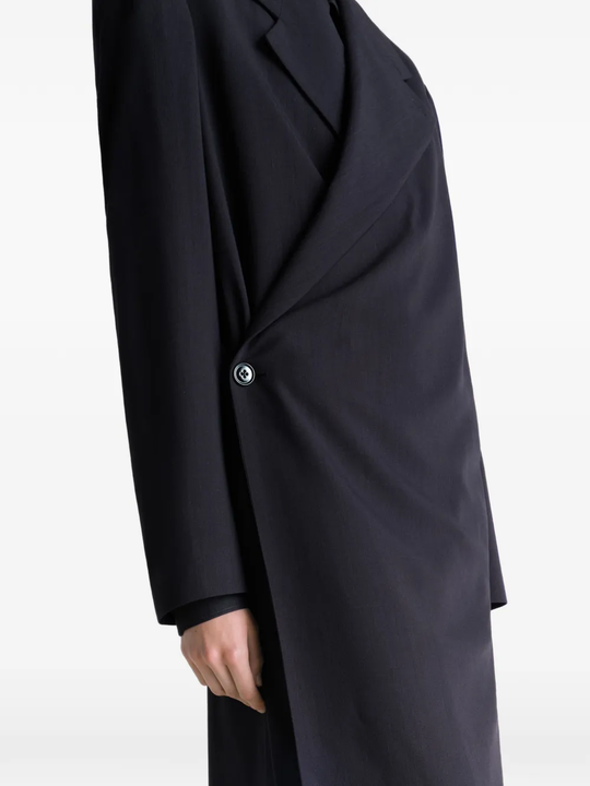 Close up of black coats , showing texture of the blended fabric