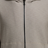 Close-up of a gray hoodie with a zipper