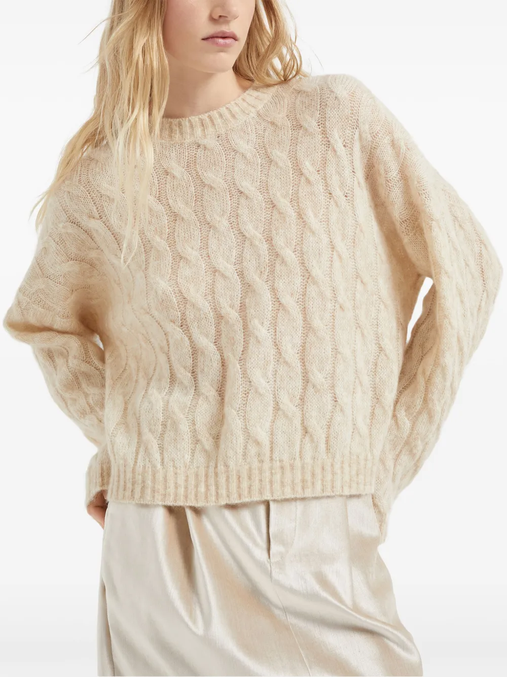 Tan knitwears worn by a person, showing the knitwears fit