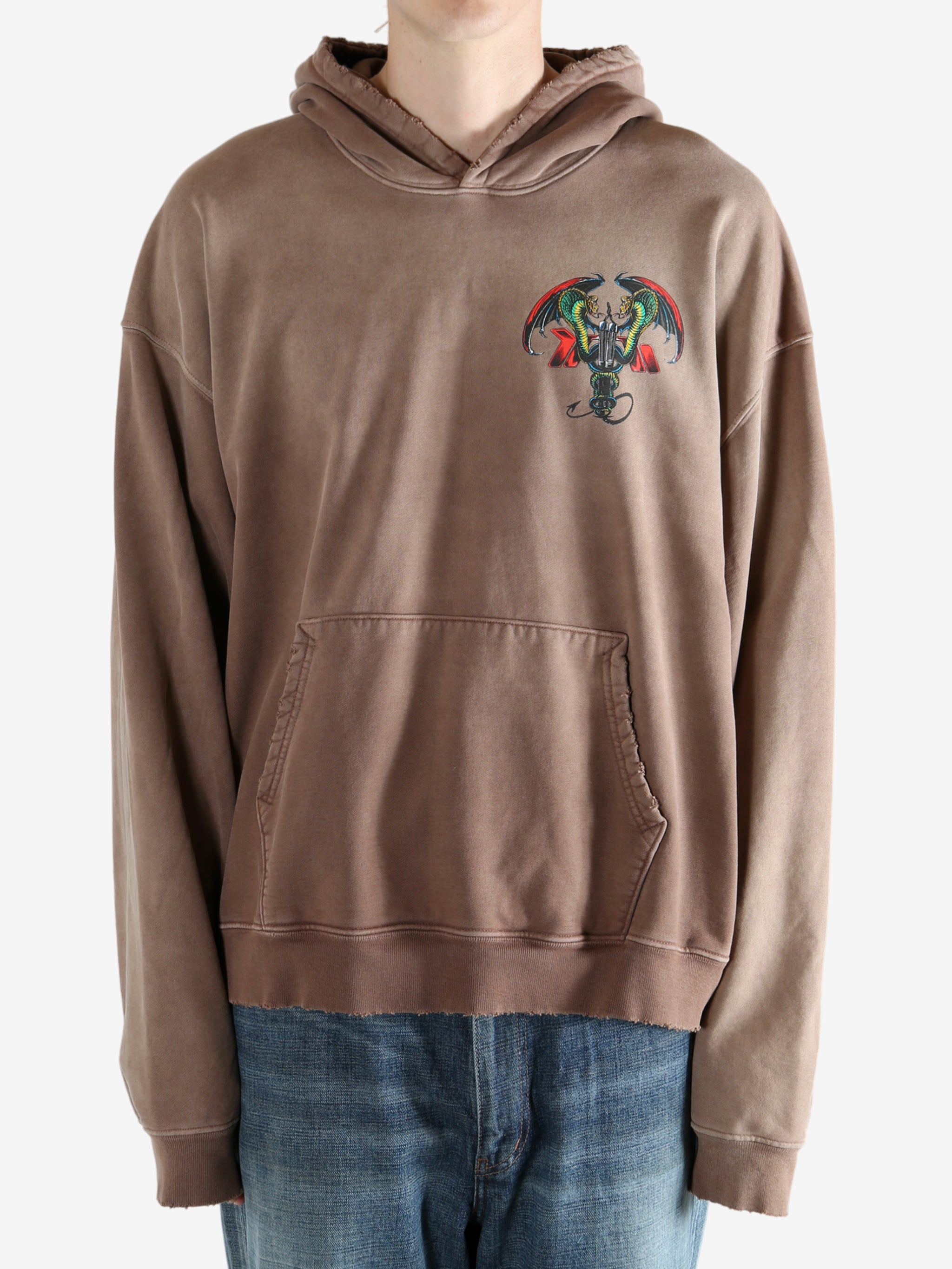 Brown hoodie worn by a person, showing the hoodie's fit