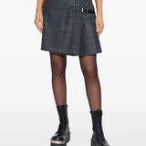 Grey skirt worn by a person, showing the skirt's fit