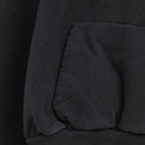Close up of Black hoodie, showing texture of the 100% cotton fabric