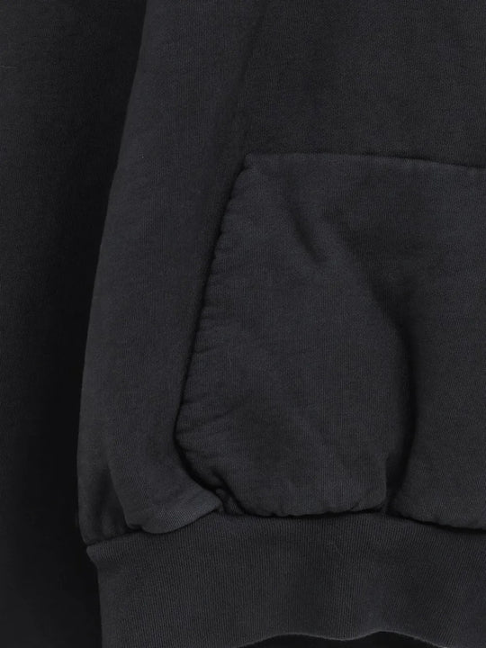 Close up of Black hoodie, showing texture of the 100% cotton fabric
