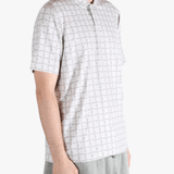 Grey shirt worn by a person, showing the shirt's fit