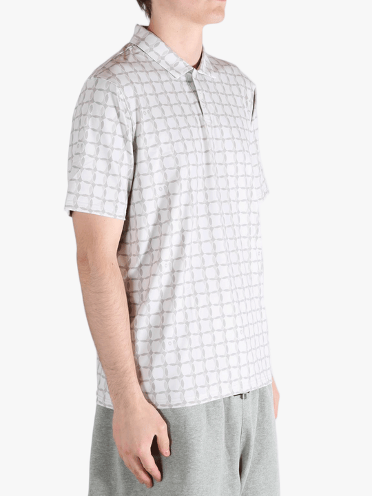Grey shirt worn by a person, showing the shirt's fit