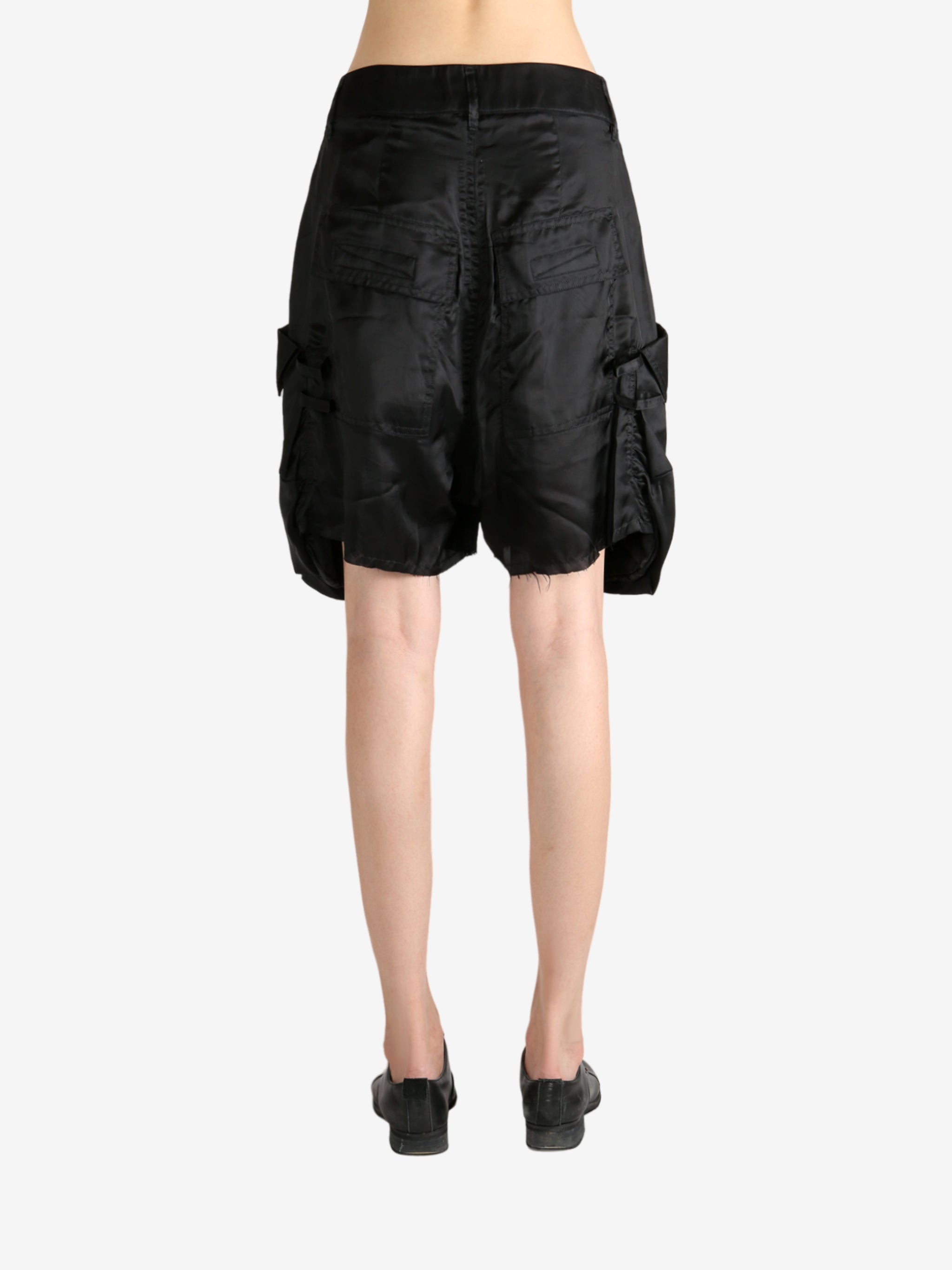 Black shorts worn by a person, showing the shorts's fit