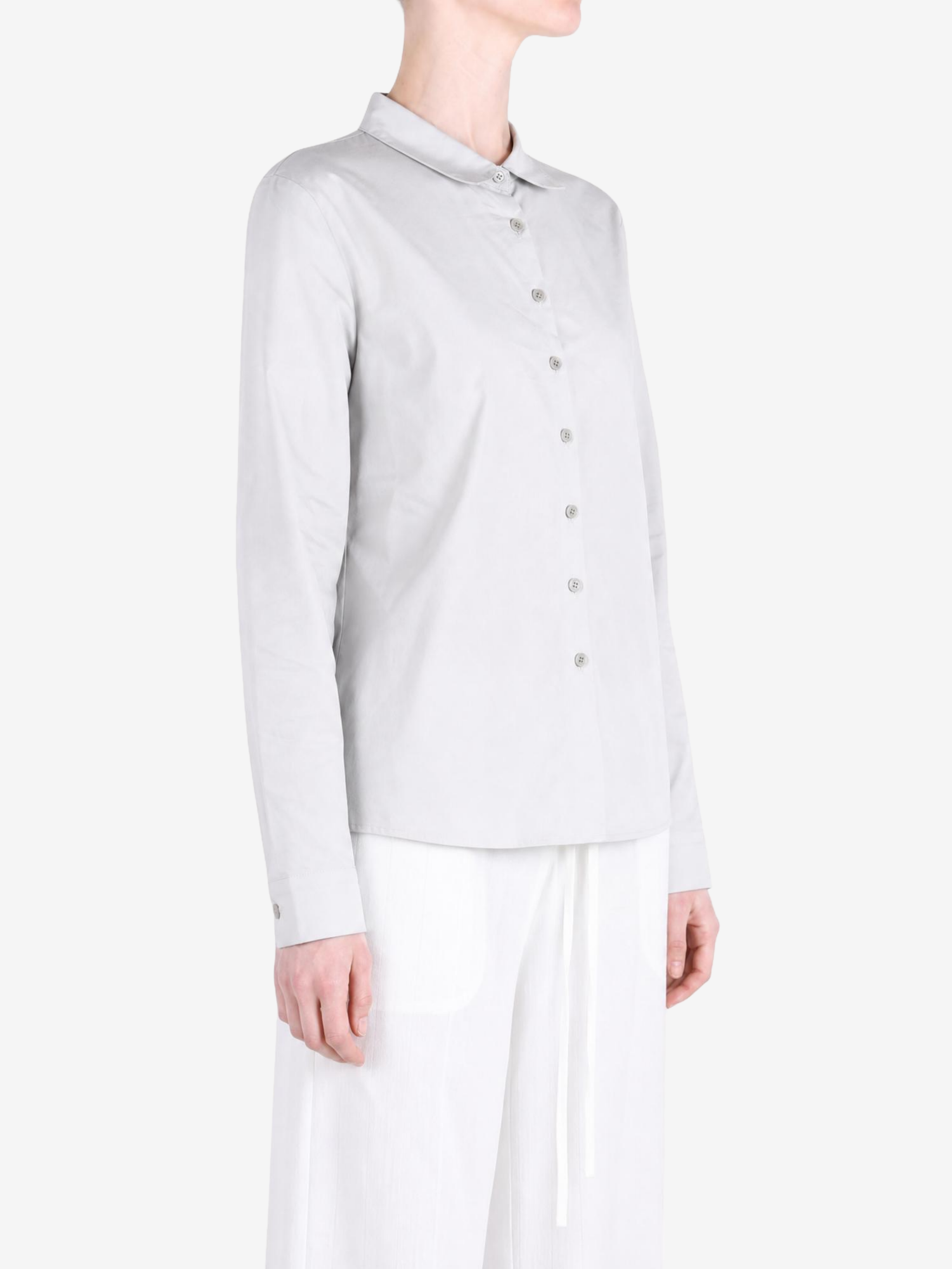 Grey shirt worn by a person, showing the shirt fit