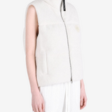 White top worn by a person, showing the top fit