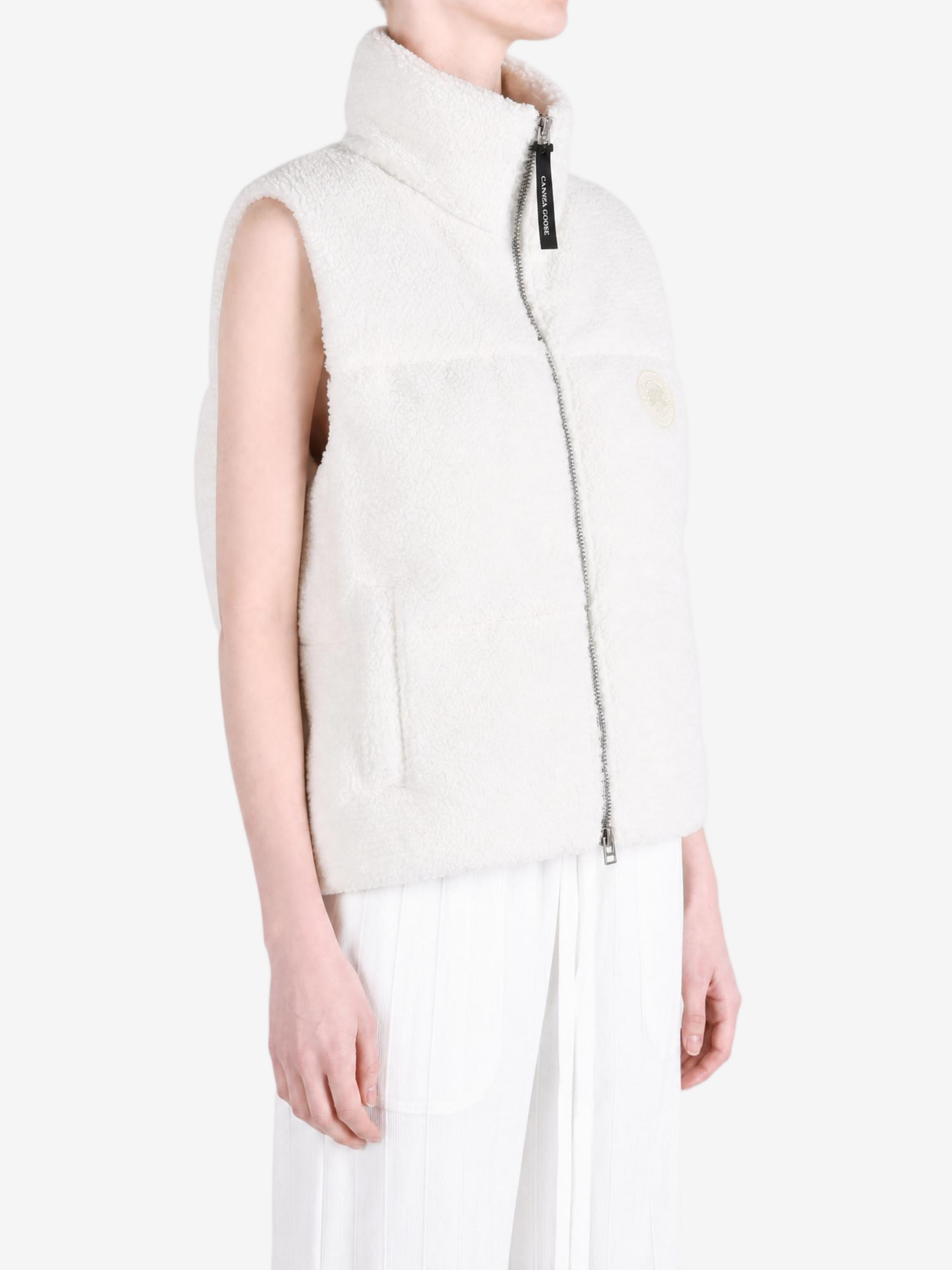 White top worn by a person, showing the top fit