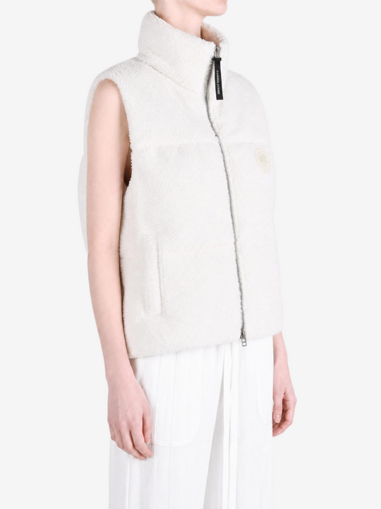 White top worn by a person, showing the top fit