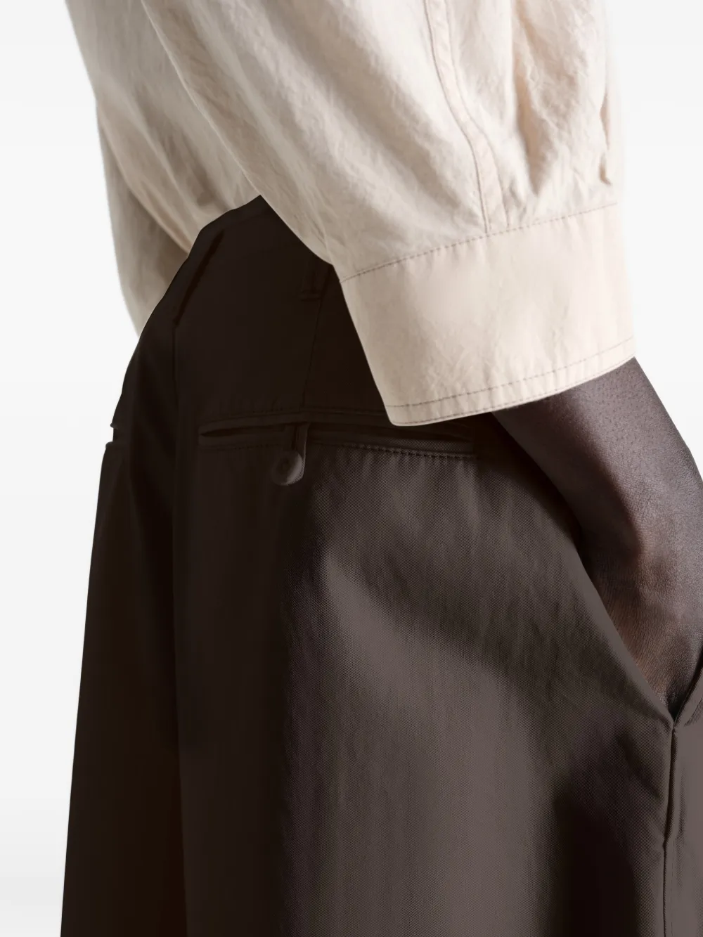 Close up of brown pant, showing texture of the cotton fabric