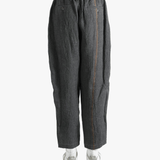 Grey pants worn by a person, showing the pants' fit