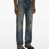 Blue jeans worn by a person, showing the jeans' fit