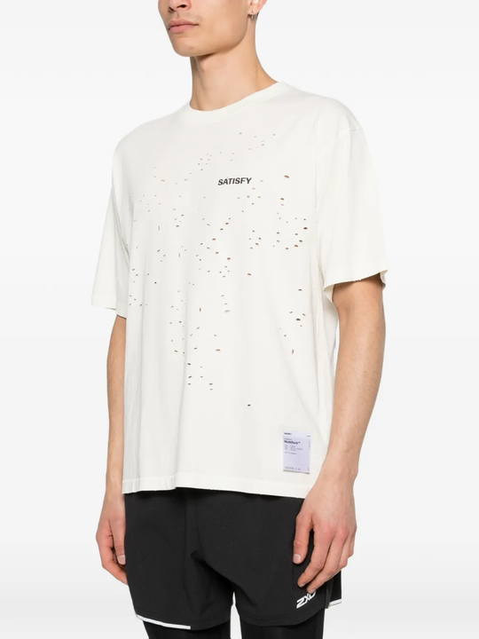 White t-shirt worn by a person, showing the t-shirt fit
