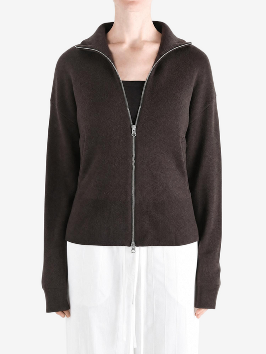 Brown knitwear worn by a person, showing the knitwear fit
