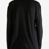 Black top worn by person, showing the top's fit