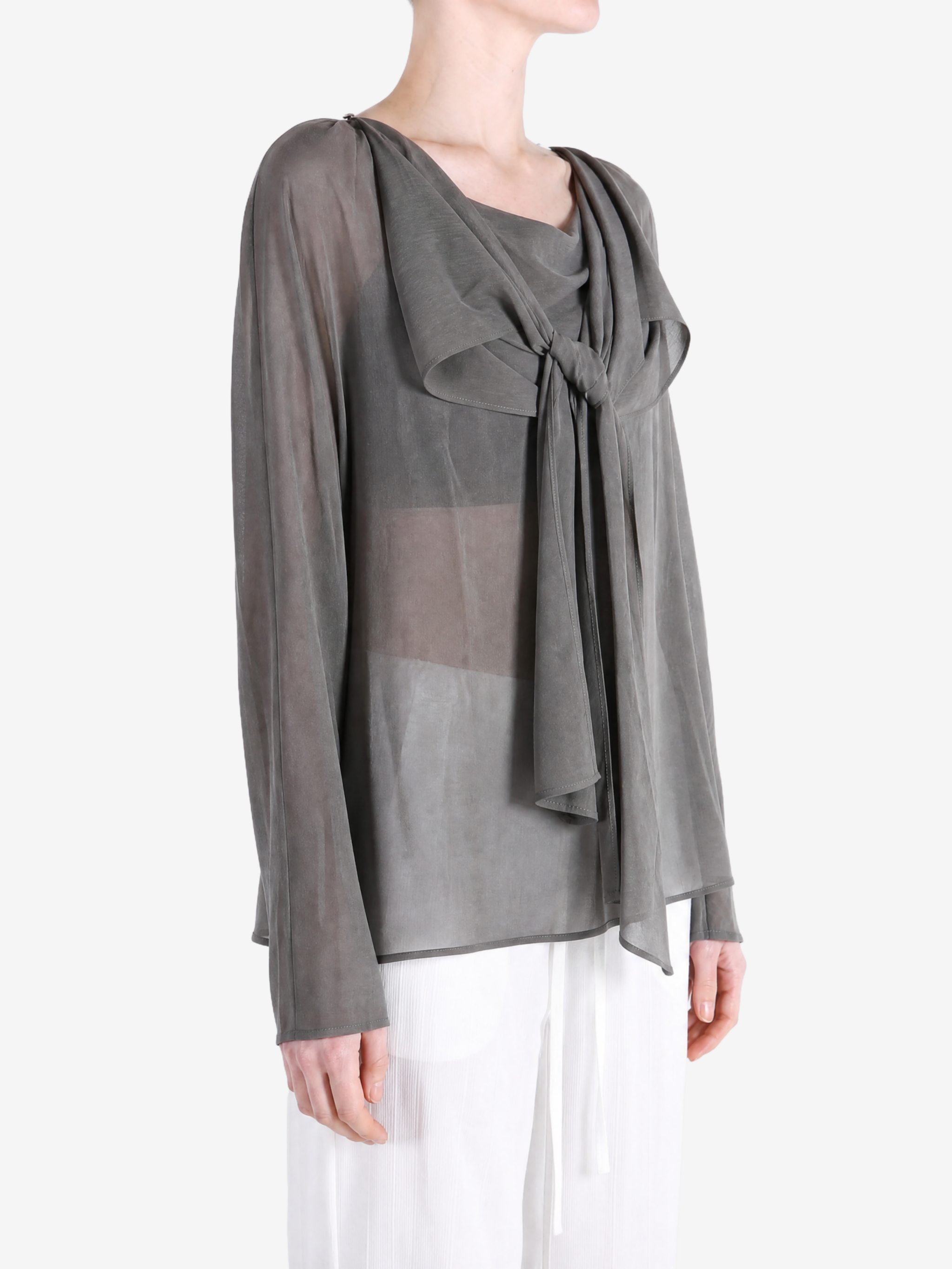 Grey top worn by a person, showing the top fit
