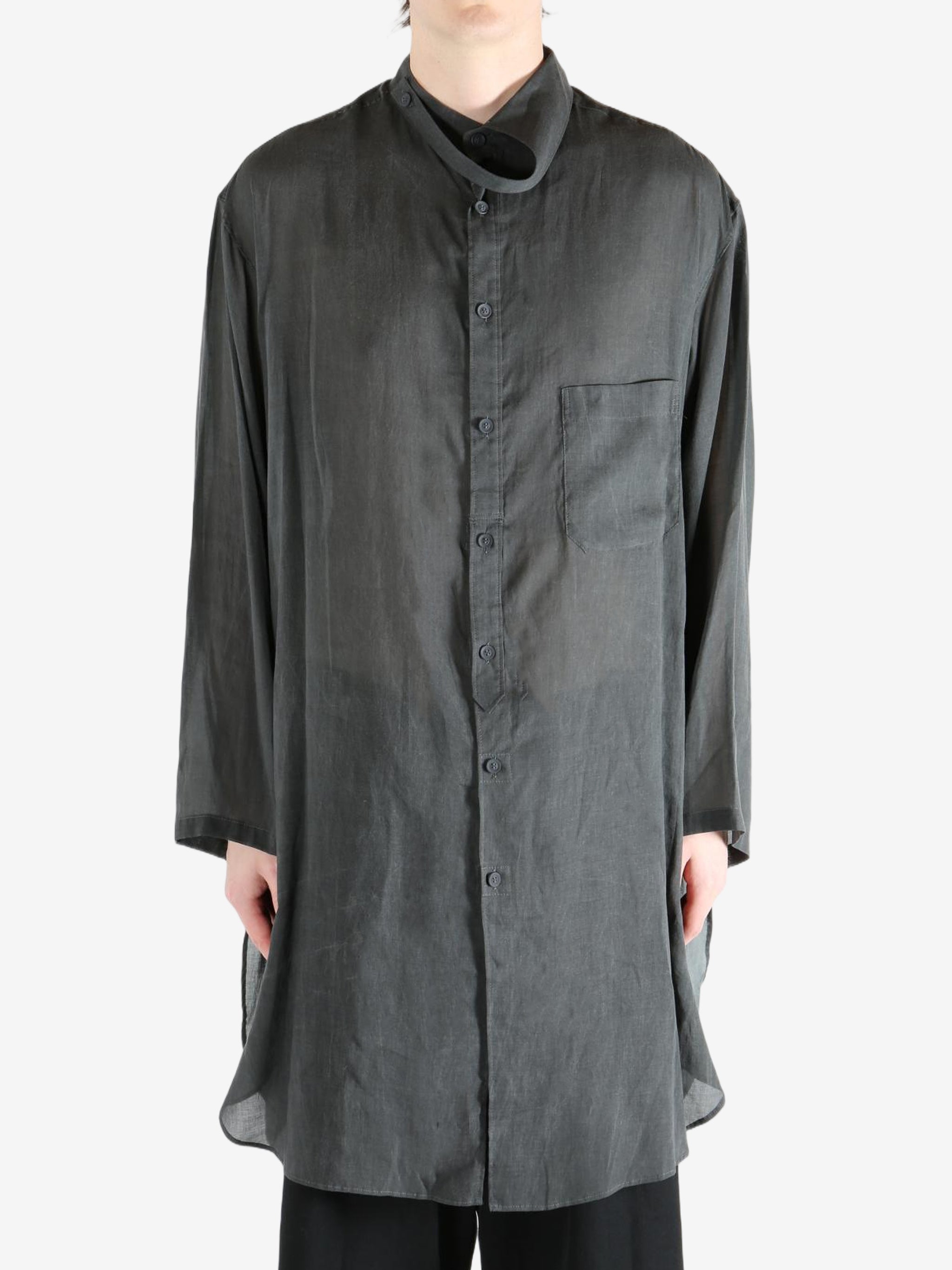 Black shirt,worn by a person, showing the shirt's fit