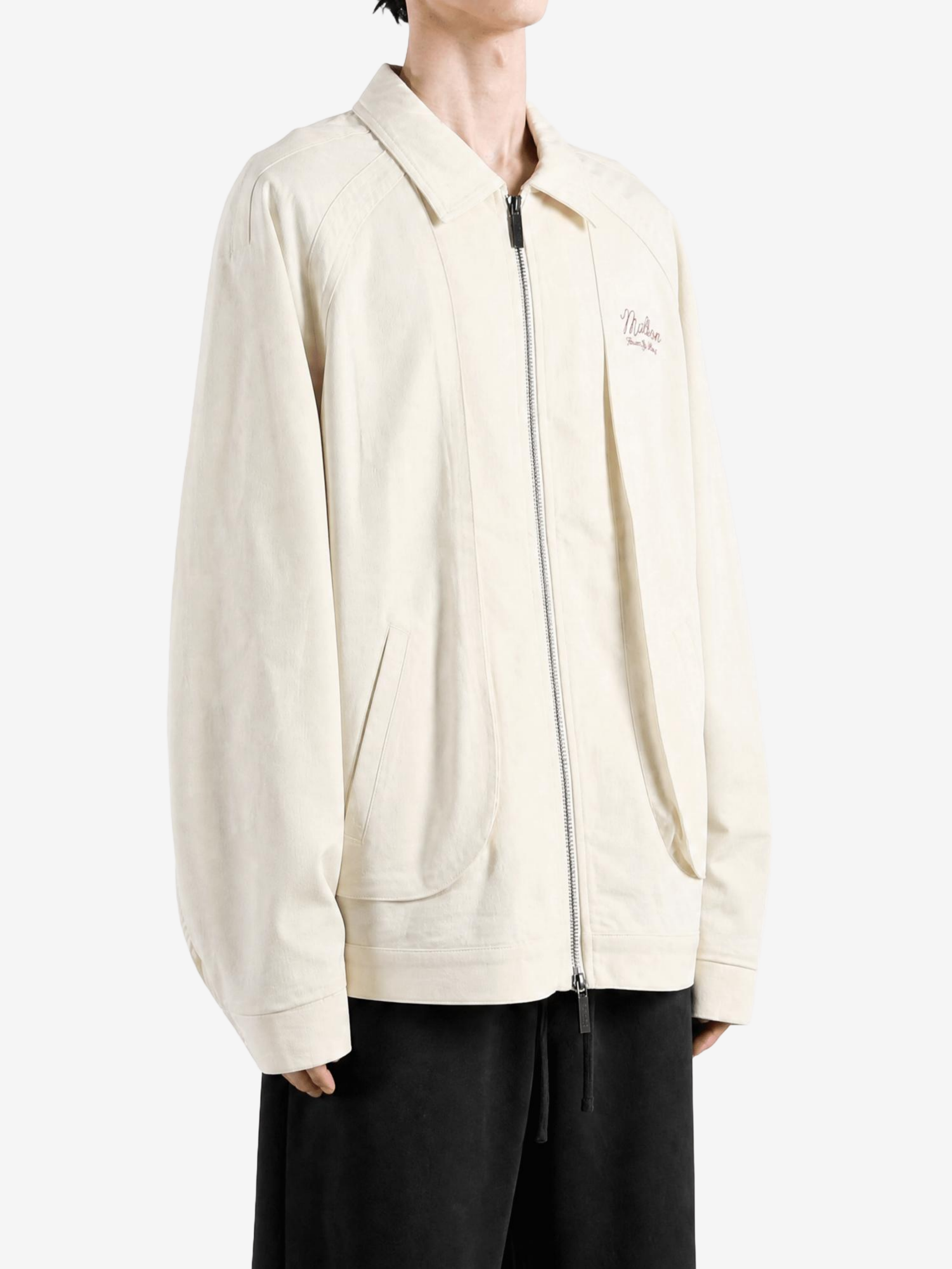 Tan jacket worn by a person, showing the jacket fit