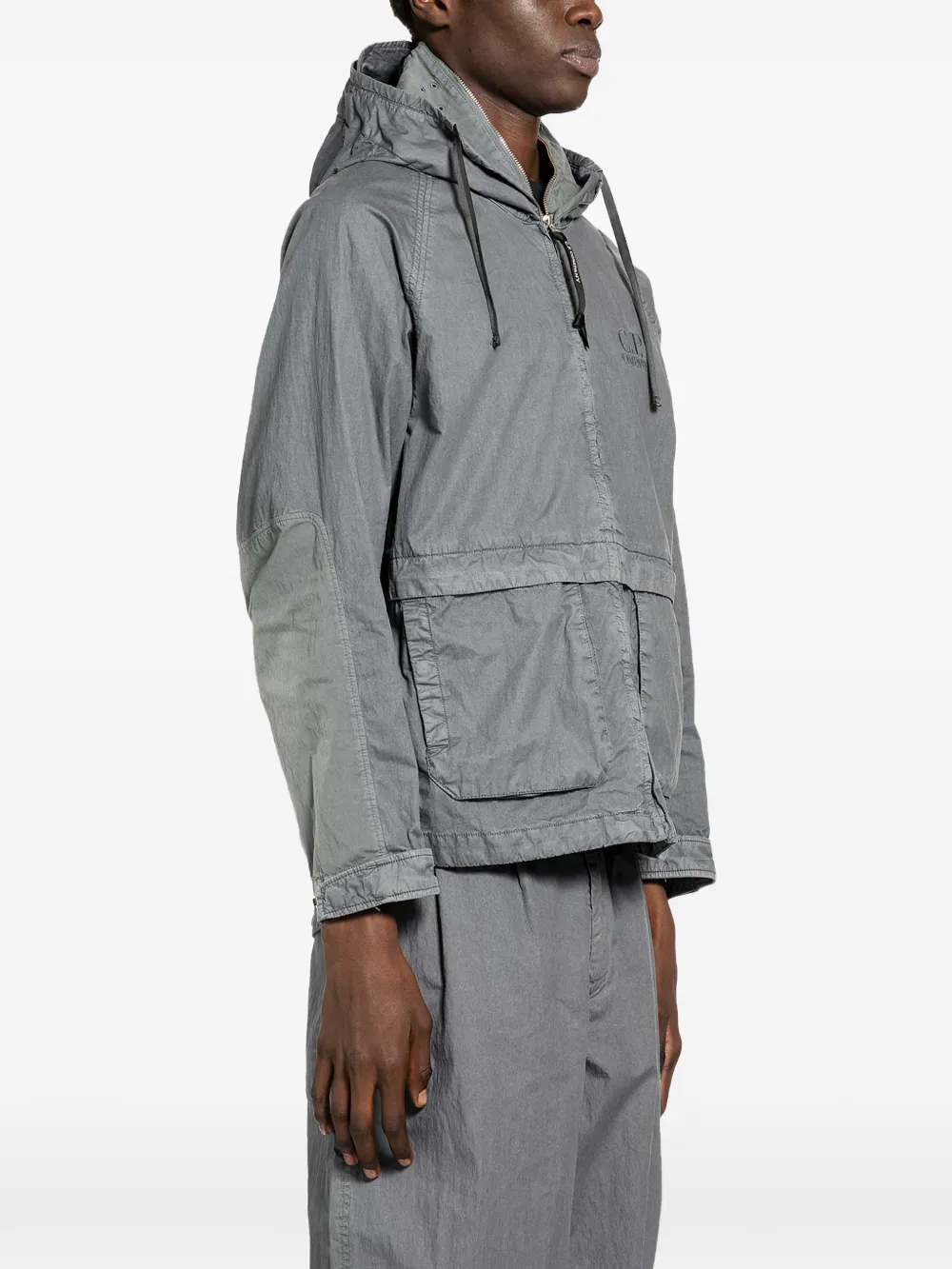 grey jackets-coats worn by a person, showing the jackets-coats fit