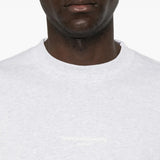 White top worn by a person, showing the top fit