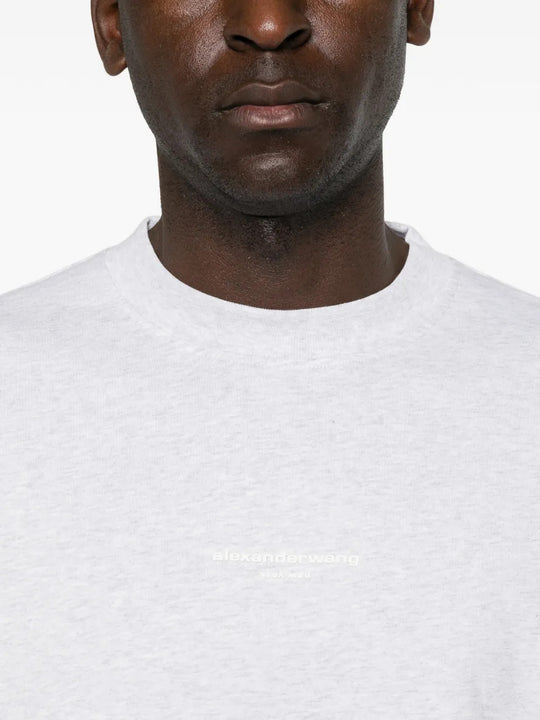 White top worn by a person, showing the top fit