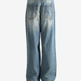 Blue pants worn by a person, showing the pants fit