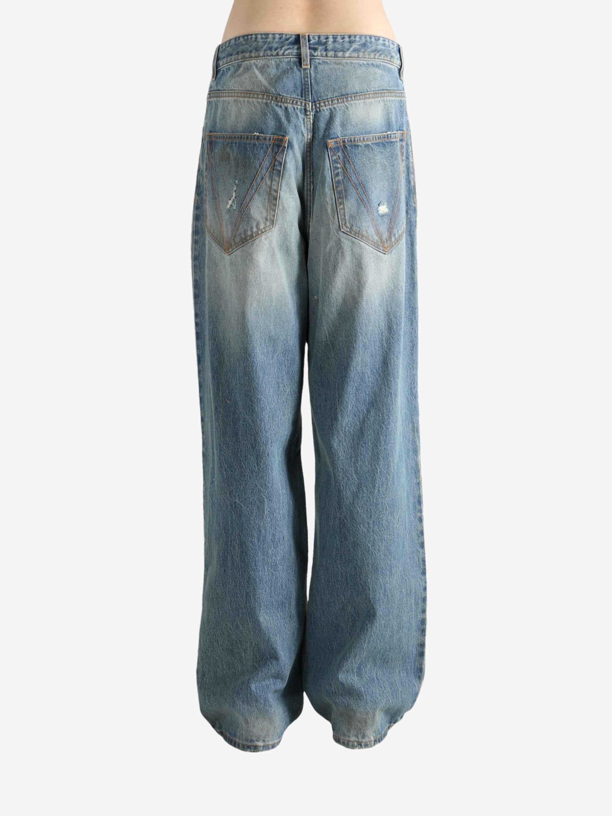 Blue pants worn by a person, showing the pants fit