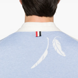 Close up of the blue knitwear, showing texture of the cotton fabric