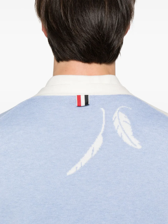 Close up of the blue knitwear, showing texture of the cotton fabric