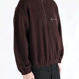 Brown hoodie worn by a person, showing the hoodie 's fit
