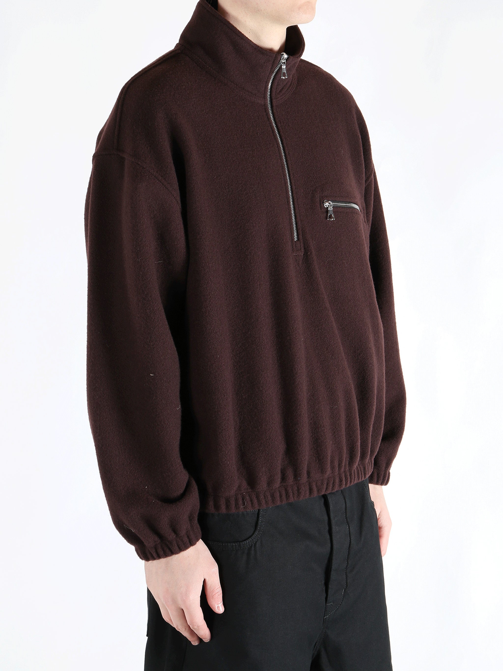 Brown hoodie worn by a person, showing the hoodie 's fit