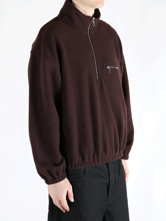 Brown hoodie worn by a person, showing the hoodie 's fit