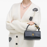 black bags worn by a person, showing the bags fit