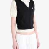Black shirt worn by a person, showing the shirt fit