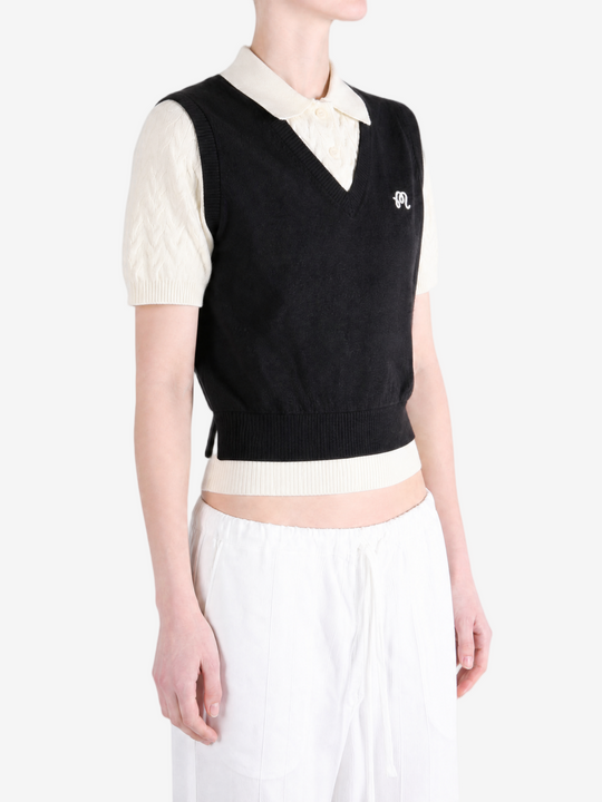 Black shirt worn by a person, showing the shirt fit