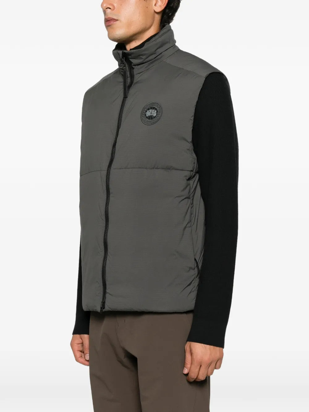 Grey jacket worn by a person, showing the jacket fit