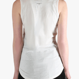 White top worn by a person, showing the top's fit