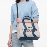 Navy bag,worn by a person, showing the bag fit