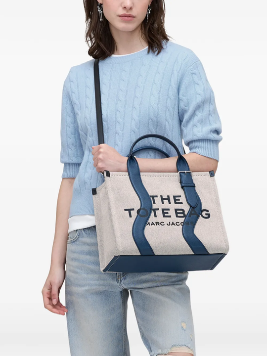 Navy bag,worn by a person, showing the bag fit