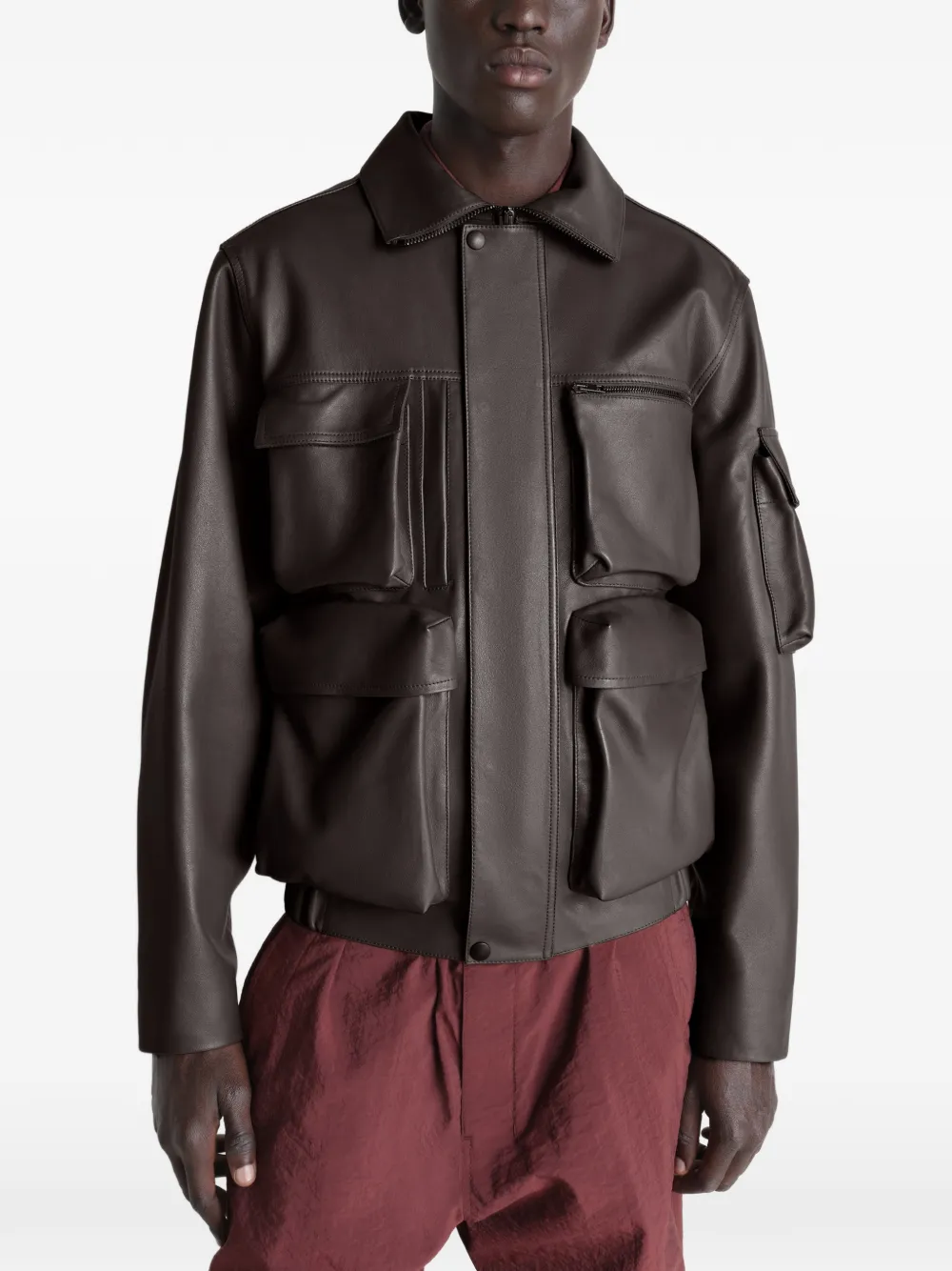 Brown coats worn by a person, showing the coats fit