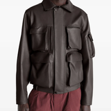 Brown coats worn by a person, showing the coats fit